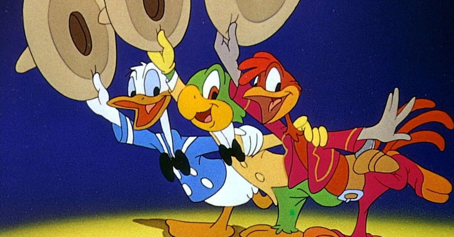 Donald Duck, José Carioca und Panchito schwenken ihre Sombreros